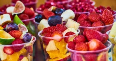 assorted fruits on disposable plastic cups